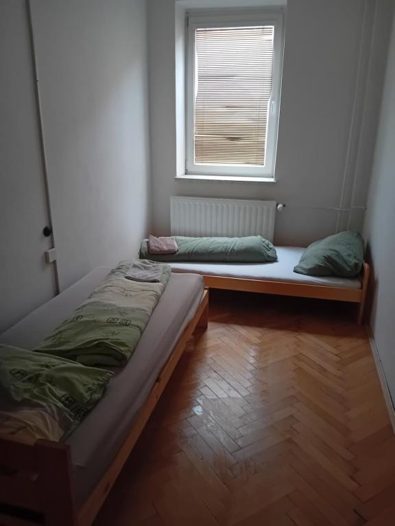 Postel nebo postele na pokoji v ubytování Holub apartment in city centrum