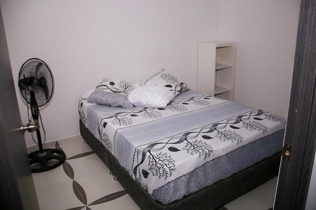 Postel nebo postele na pokoji v ubytování Condominio Tolima