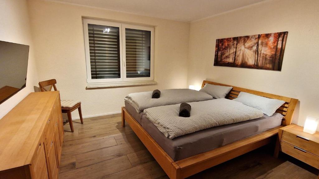 Postel nebo postele na pokoji v ubytování Blütenlodge Bodensee
