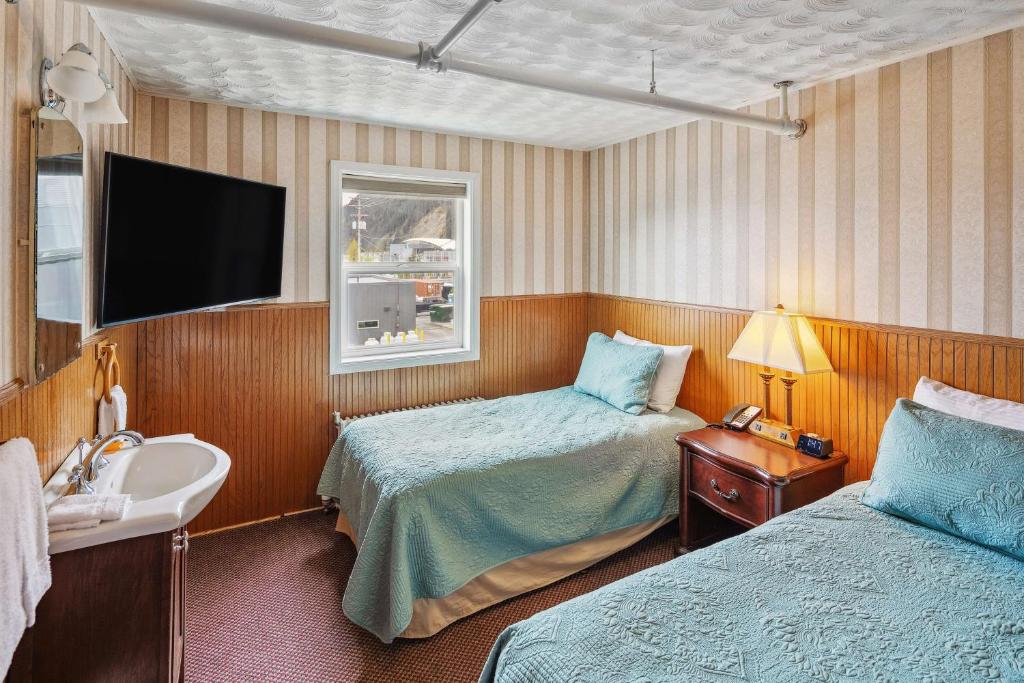 Postel nebo postele na pokoji v ubytování Hotel Seward