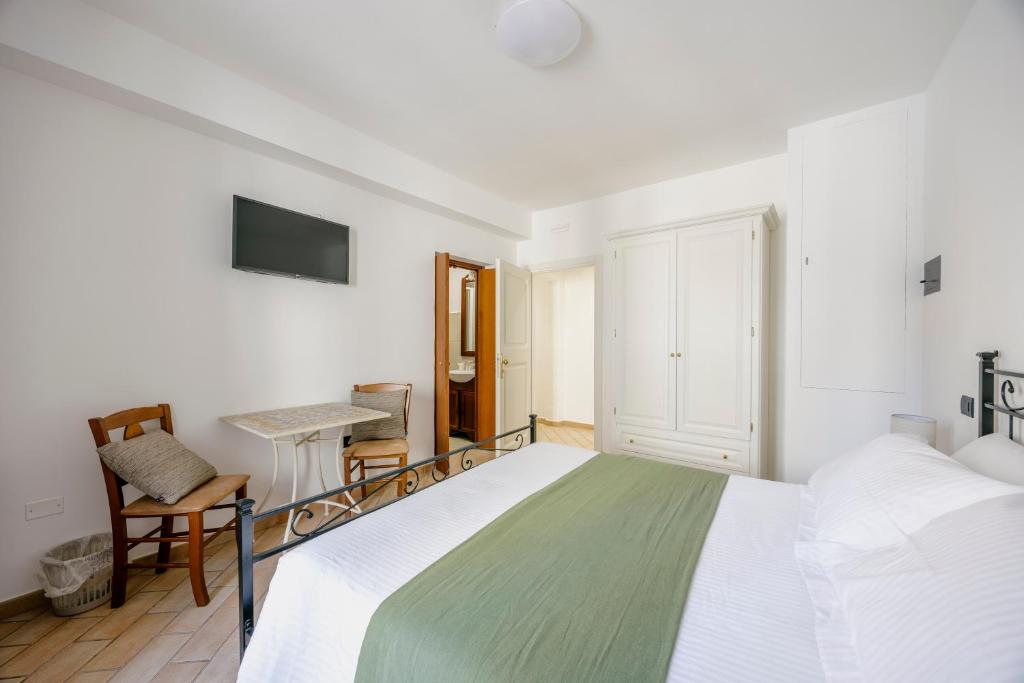 Postel nebo postele na pokoji v ubytování La Cattedrale Rooms