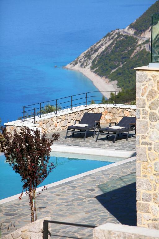 a swimming pool with a view of the ocean at Point of View Cassiopeia in Drymon
