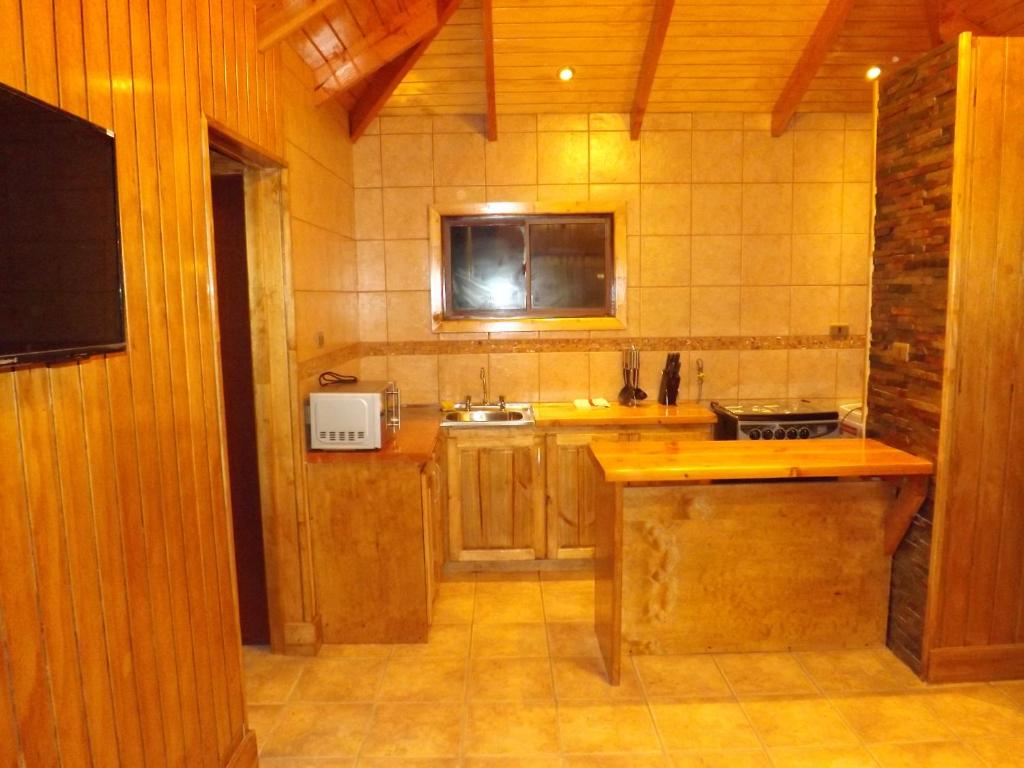 Kuchyň nebo kuchyňský kout v ubytování Hotel y Cabañas Pulegan