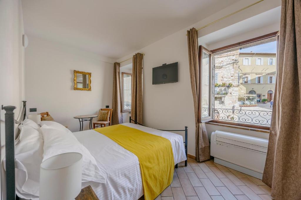 Postel nebo postele na pokoji v ubytování La Cattedrale Rooms