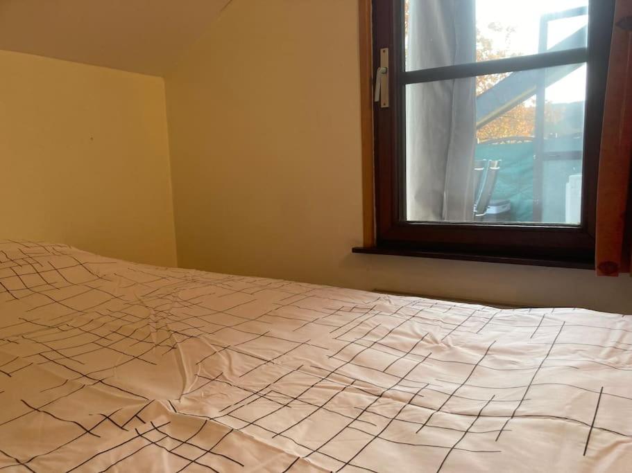 Postel nebo postele na pokoji v ubytování Le lit de la Semois