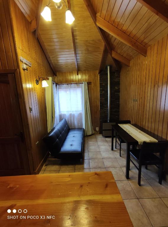 Postel nebo postele na pokoji v ubytování Hotel y Cabañas Pulegan