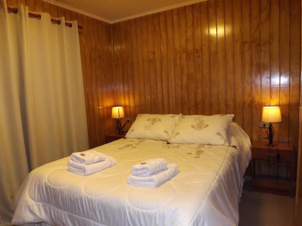 Postel nebo postele na pokoji v ubytování Hotel y Cabañas Pulegan