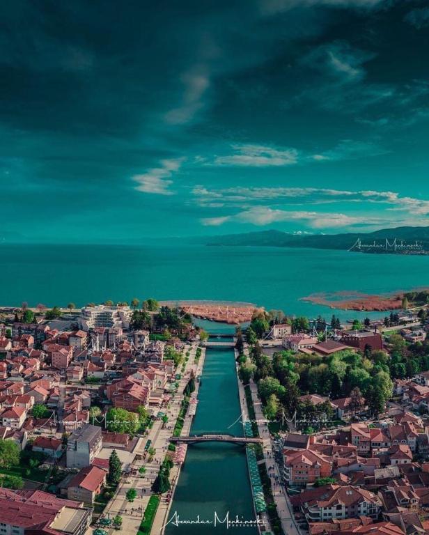 an aerial view of a city next to the water at Hotel Palace Struga in Struga