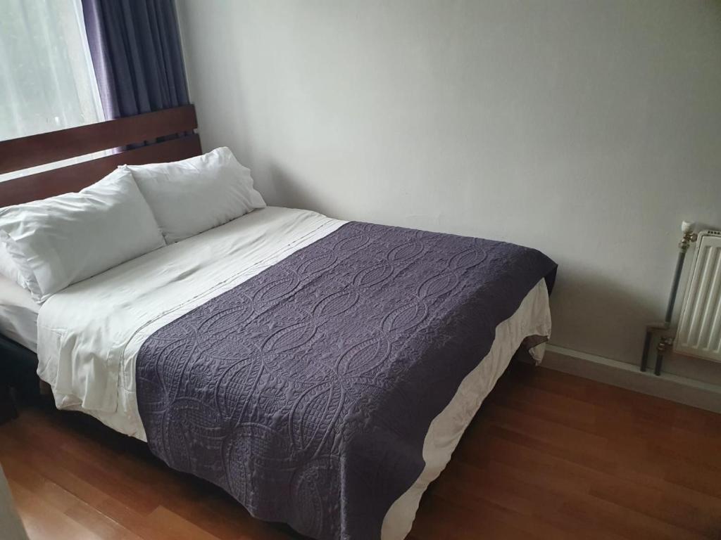 Cama o camas de una habitación en Hostal del Rio