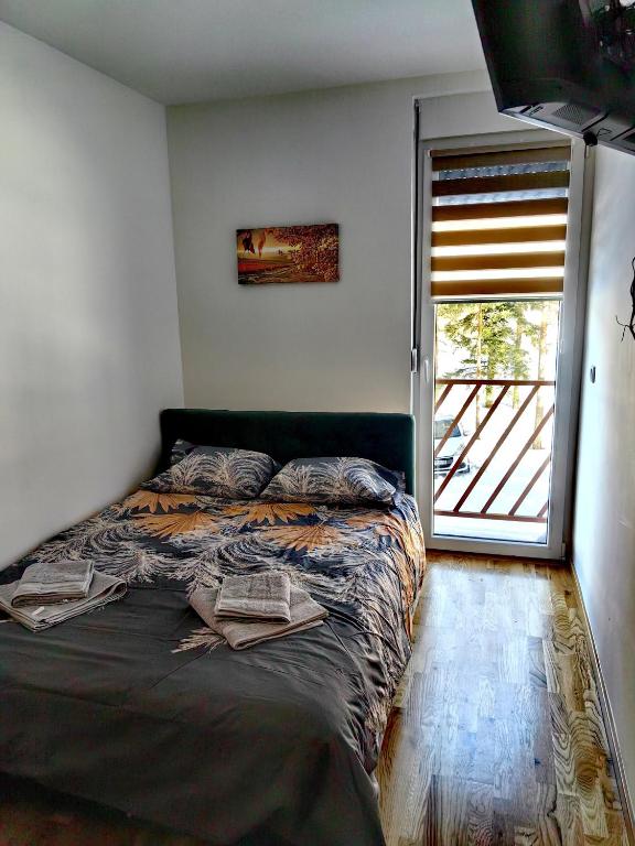 Postel nebo postele na pokoji v ubytování Vila Rosa, apartman 2