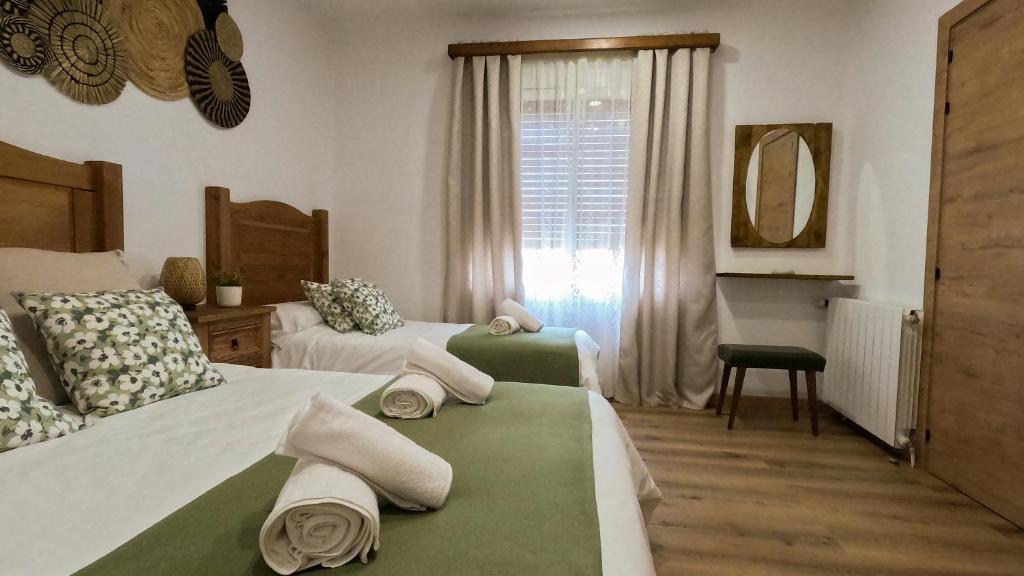 Postel nebo postele na pokoji v ubytování La Cantera
