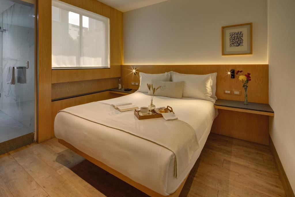 Postel nebo postele na pokoji v ubytování Reforma Guest House