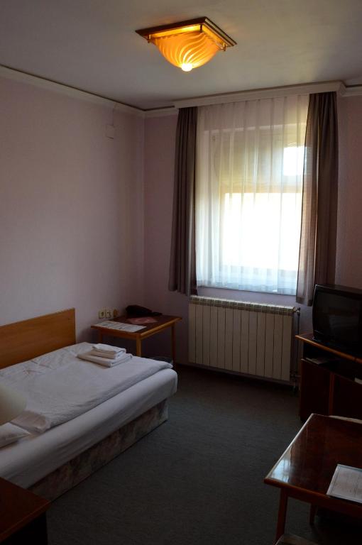 Postel nebo postele na pokoji v ubytování Apollo Motel