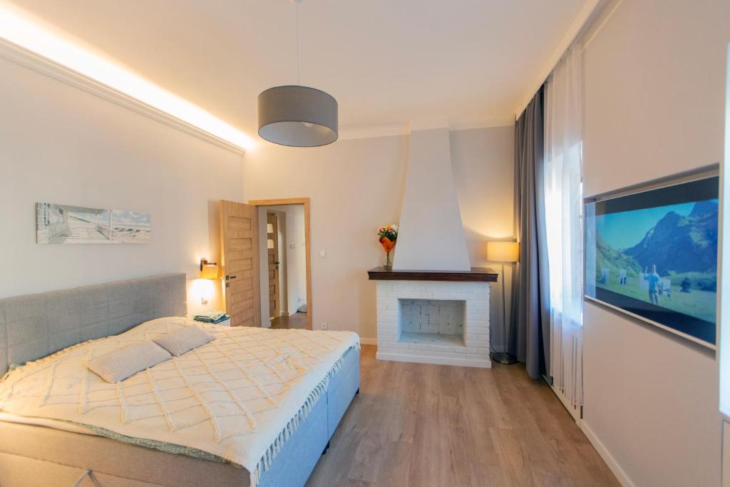 Un pat sau paturi într-o cameră la Premium Apartment - Brama Krakowska - Old Town