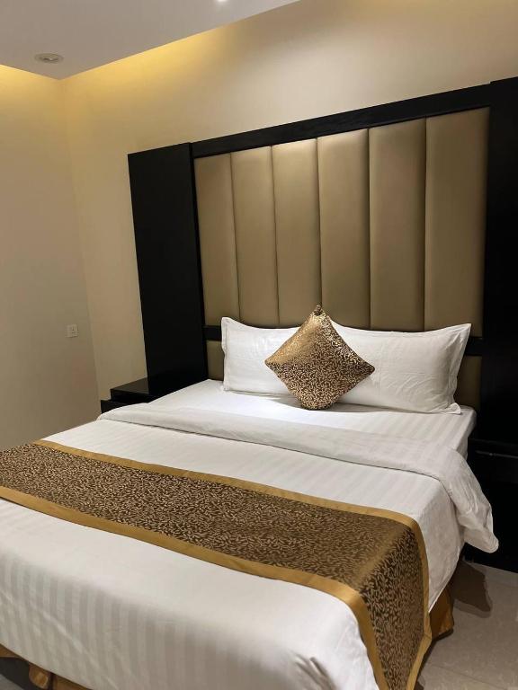 Postel nebo postele na pokoji v ubytování Alwan apartment hotel
