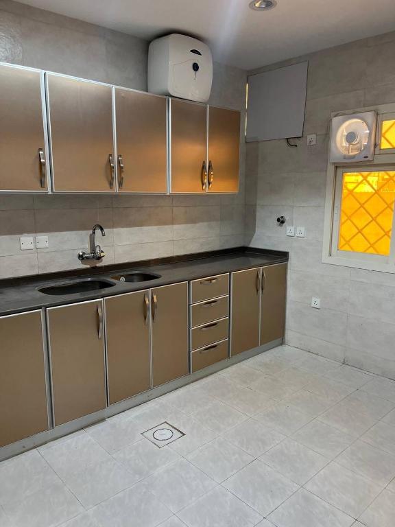 Kuchyň nebo kuchyňský kout v ubytování Alwan apartment hotel