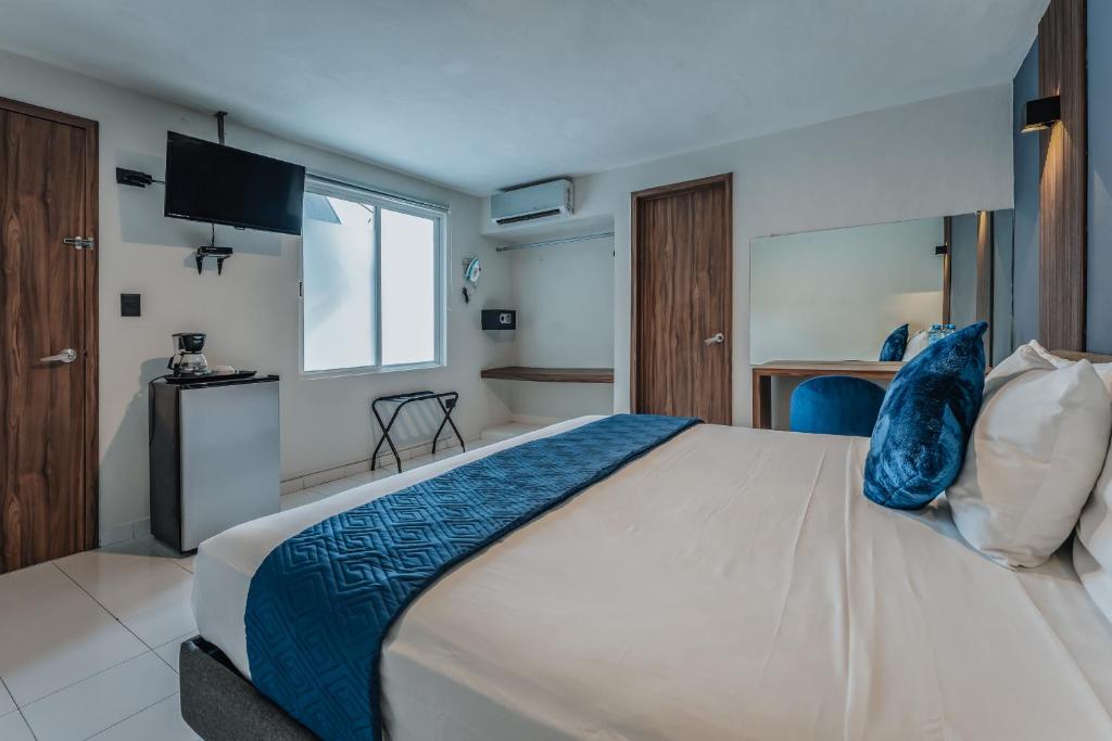 Postel nebo postele na pokoji v ubytování Hotel Casa Nova, Merida