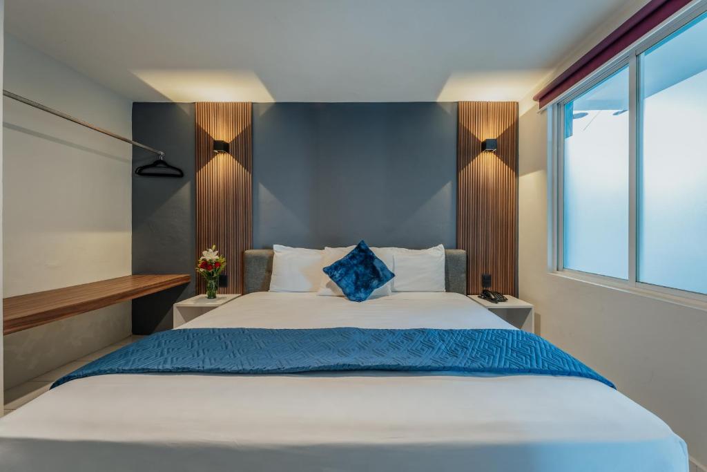 Postel nebo postele na pokoji v ubytování Hotel Casa Nova, Merida