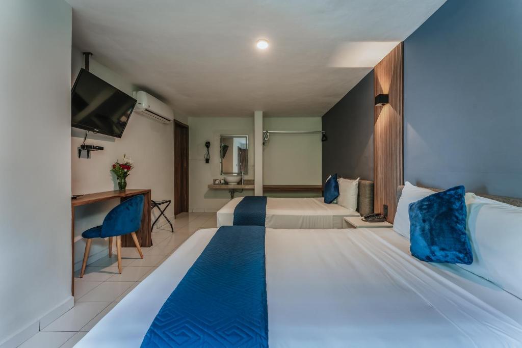 Postel nebo postele na pokoji v ubytování Hotel Casa Nova, Merida