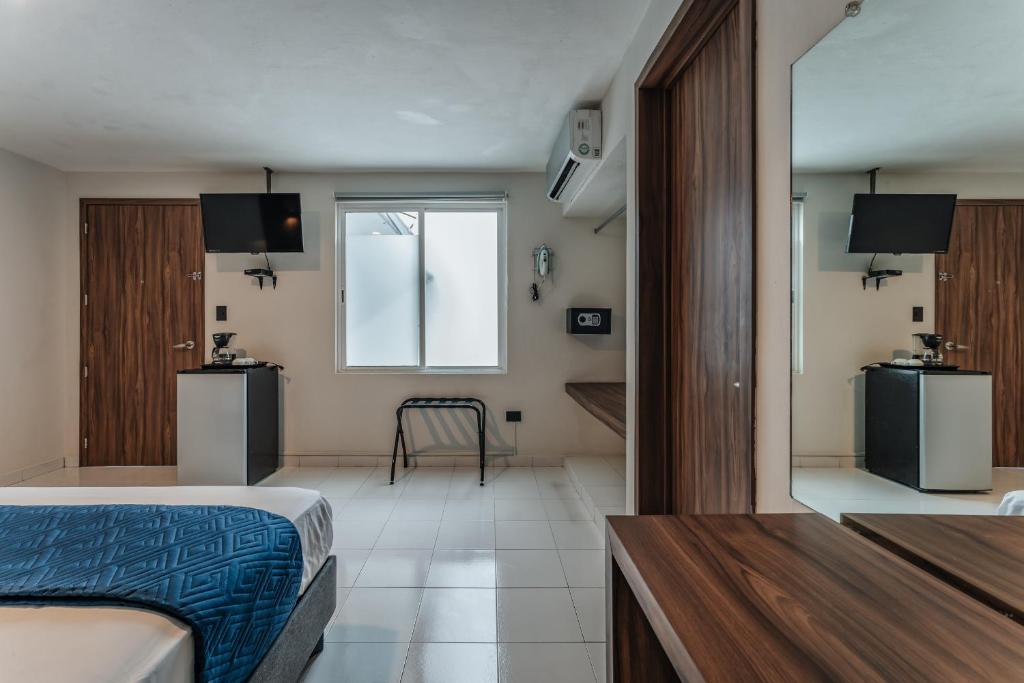 TV a/nebo společenská místnost v ubytování Hotel Casa Nova, Merida