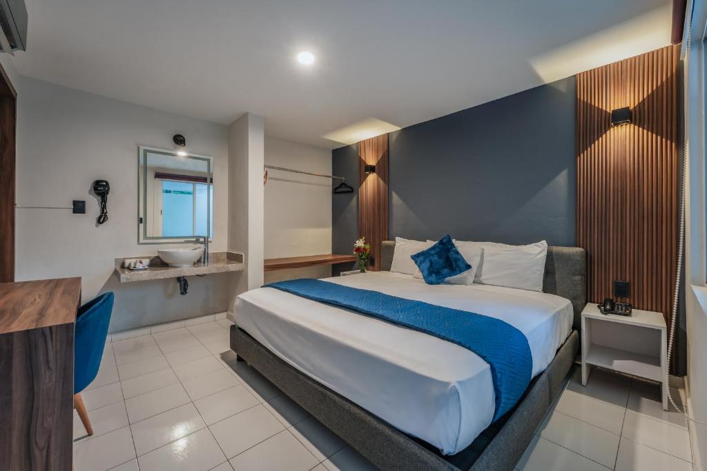 Postel nebo postele na pokoji v ubytování Hotel Casa Nova, Merida