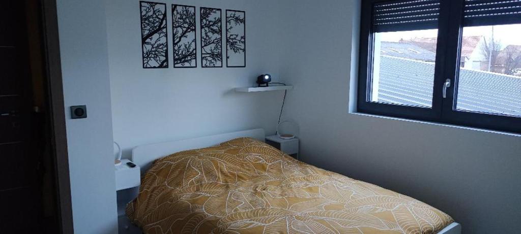 Postel nebo postele na pokoji v ubytování en toute simplicité
