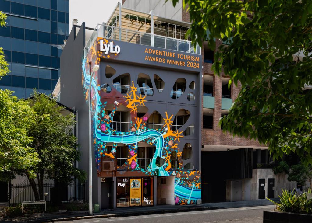 a building with a mural on the side of it at LyLo Brisbane in Brisbane