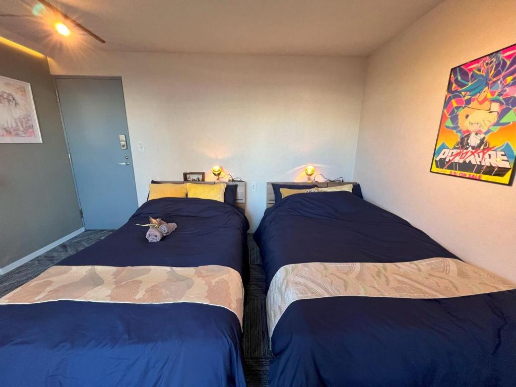Postel nebo postele na pokoji v ubytování Hotel Tokyo Hub