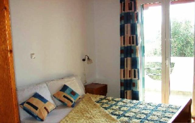 Postel nebo postele na pokoji v ubytování Olympia Paxos Villas & Apartments