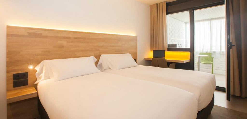 Cama o camas de una habitación en Hotel A Pamplona