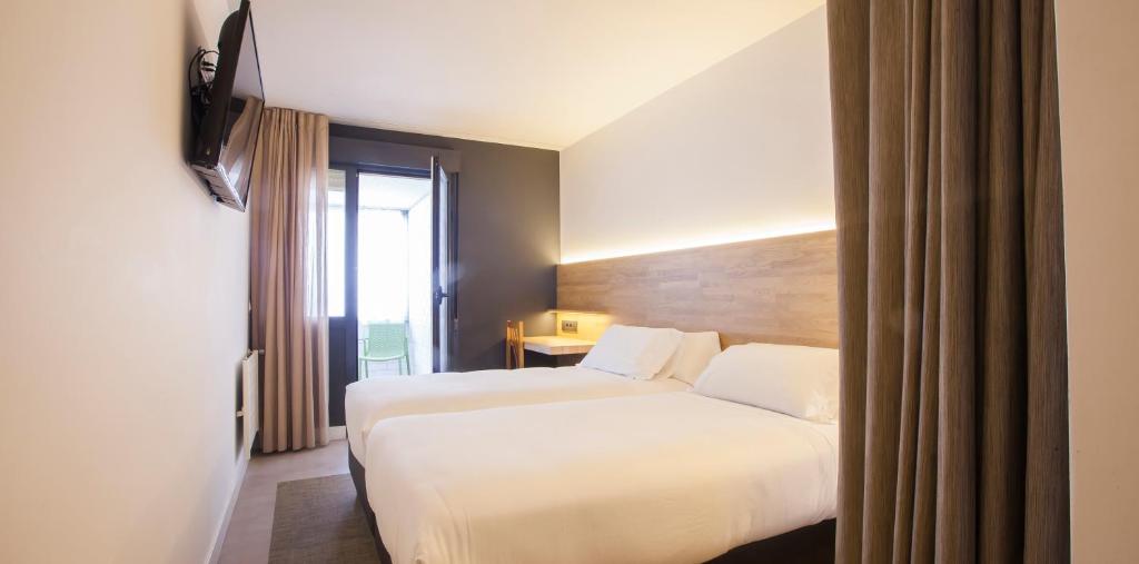 Cama o camas de una habitación en Hotel A Pamplona