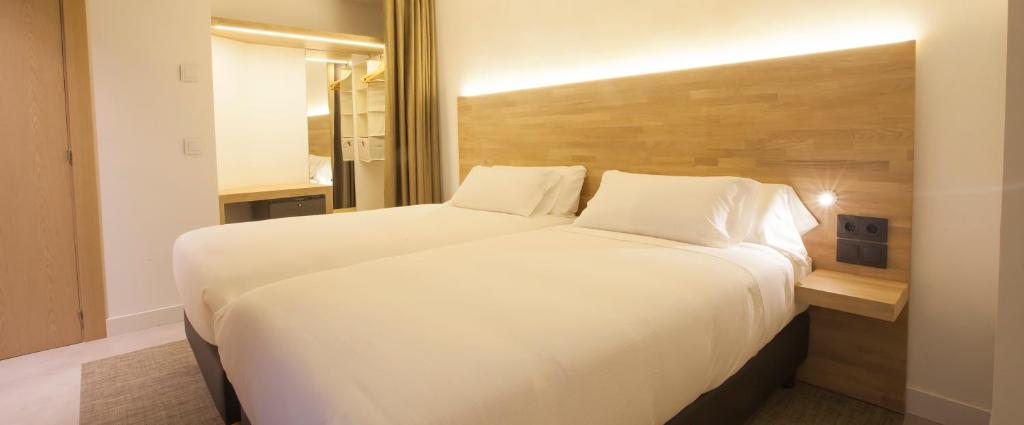 Cama o camas de una habitación en Hotel A Pamplona
