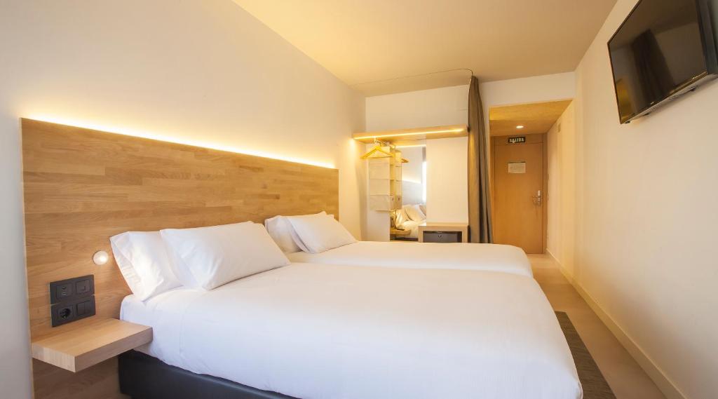 Cama o camas de una habitación en Hotel A Pamplona