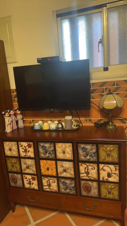 TV a/nebo společenská místnost v ubytování Xinqin B&B - City Area