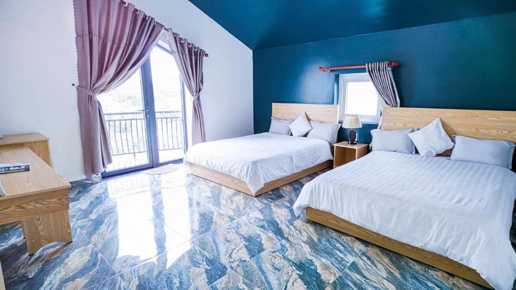 Postel nebo postele na pokoji v ubytování Villa Hotel Rung Thong Da Lat