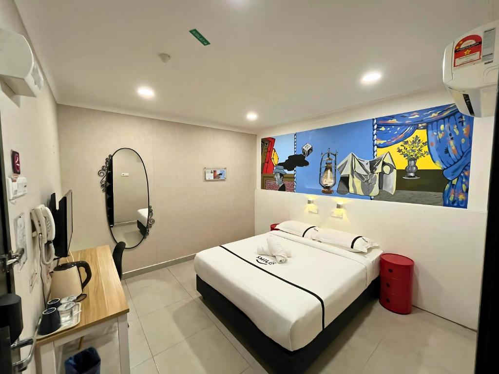 Postel nebo postele na pokoji v ubytování Smile Hotel Shah Alam ICity