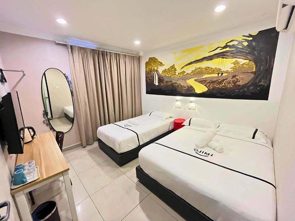 Postel nebo postele na pokoji v ubytování Smile Hotel Shah Alam ICity