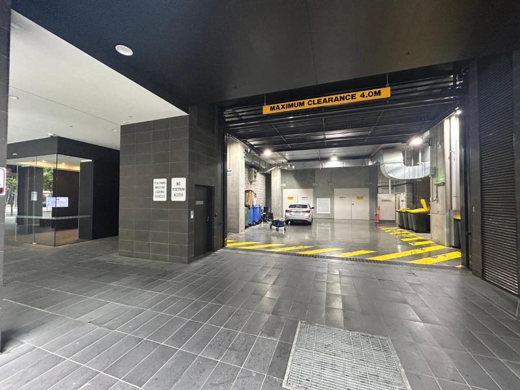 a parking garage with a car parked in it at Immaculate 1br Apt In Docklands Pool Free Parking in Melbourne