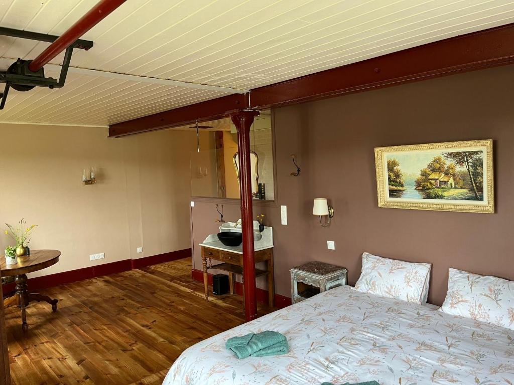 Postel nebo postele na pokoji v ubytování Moulin de Maupoy