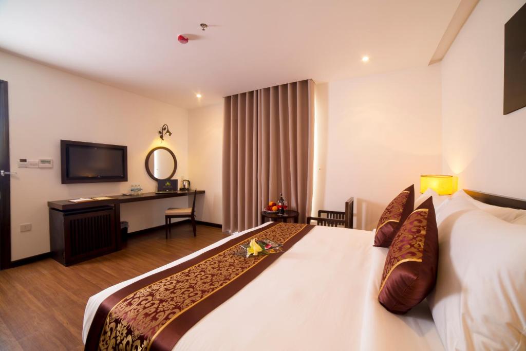 Postel nebo postele na pokoji v ubytování Edele Hotel Nha Trang Beach