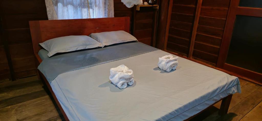 Postel nebo postele na pokoji v ubytování Sambath Sakseth Bungalow