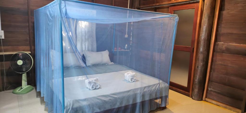 Postel nebo postele na pokoji v ubytování Sambath Sakseth Bungalow