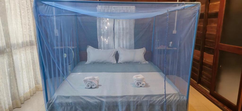 Postel nebo postele na pokoji v ubytování Sambath Sakseth Bungalow