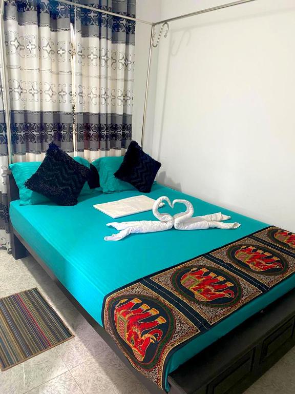 Postel nebo postele na pokoji v ubytování Haritha Resort Yala
