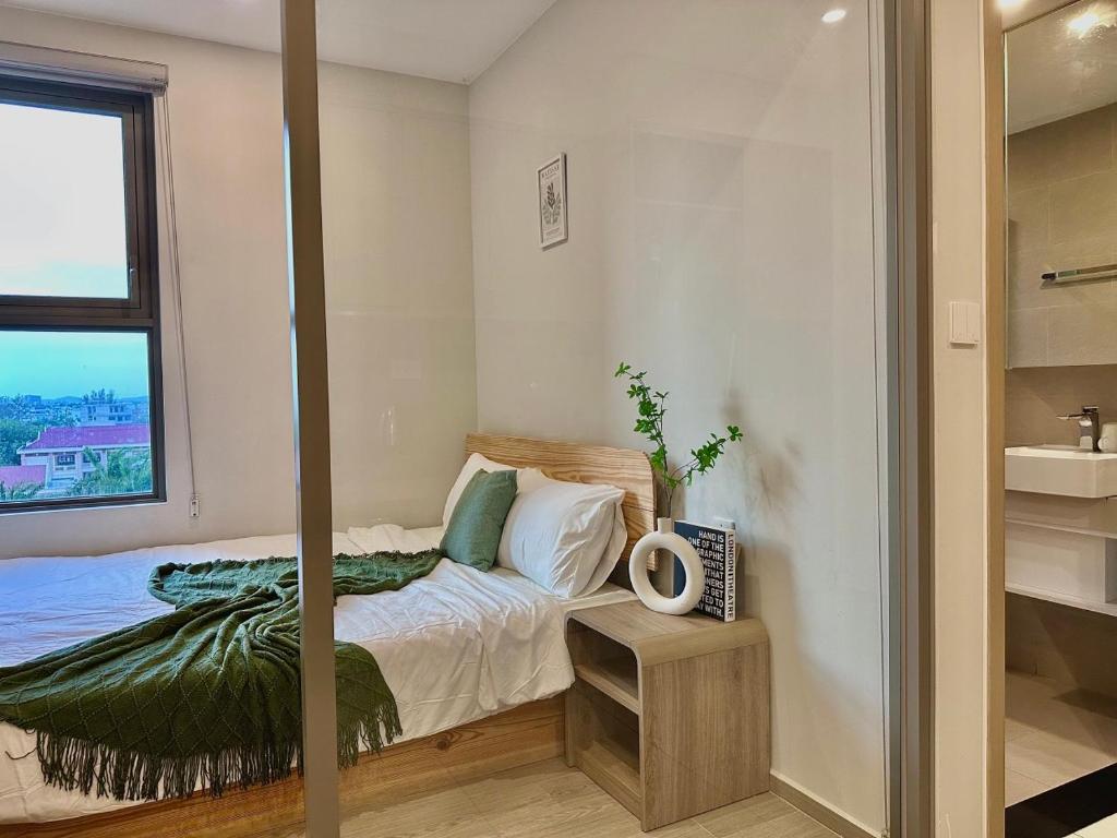 Giường trong phòng chung tại The Sóng Apartment 5 Stars Vung Tau - Căn Hộ Du Lịch Biển 5 Sao Vũng Tàu - MINH TOẢN's Homestay