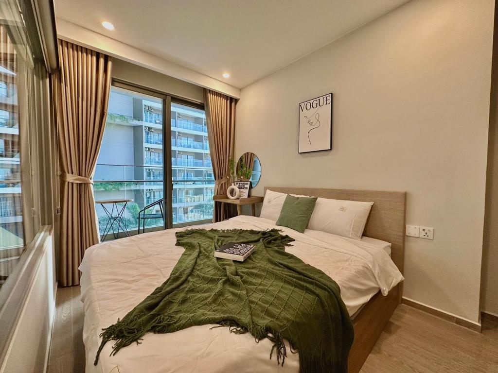 Giường trong phòng chung tại The Sóng Apartment 5 Stars Vung Tau - Căn Hộ Du Lịch Biển 5 Sao Vũng Tàu - MINH TOẢN's Homestay