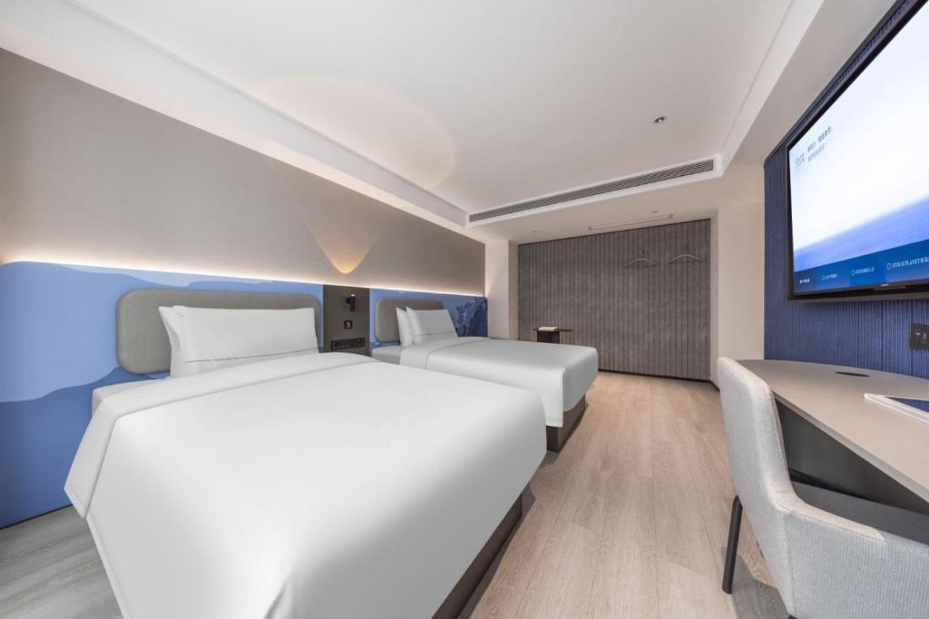 Postel nebo postele na pokoji v ubytování Atour Light Hotel Kunming Dongfeng Plaza Beijing Road