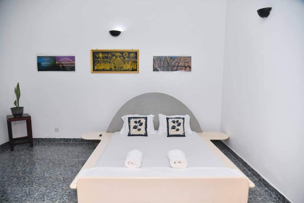 Postel nebo postele na pokoji v ubytování Villa leela