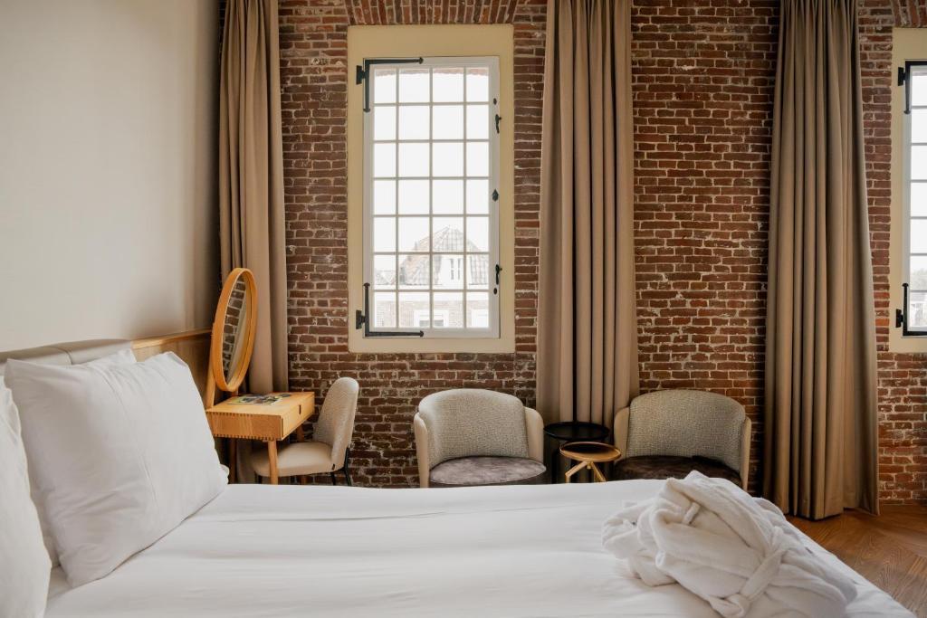Postel nebo postele na pokoji v ubytování Hotel Arsenaal Delft