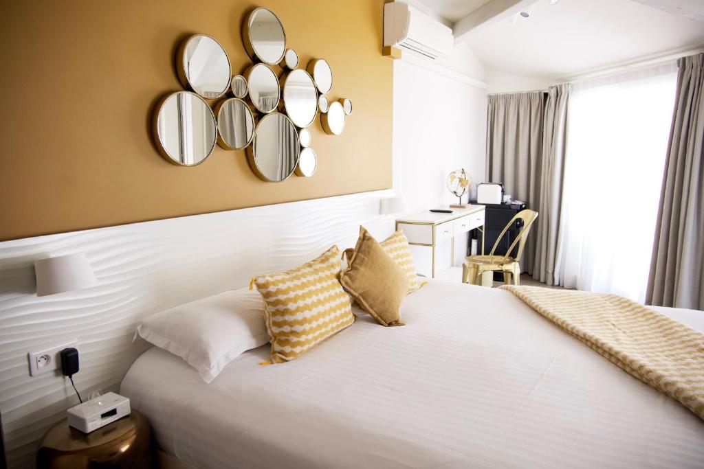 Кровать или кровати в номере Boutique Hotel & Spa la Villa Cap Ferrat
